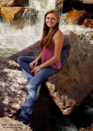 Holly High School Senior Portrait Sitting on Rocks in Creek